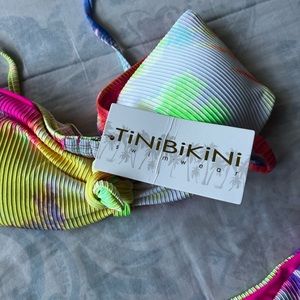 2 bikinis brand new. Size adults M and adult bathing suite size 20w for woman.